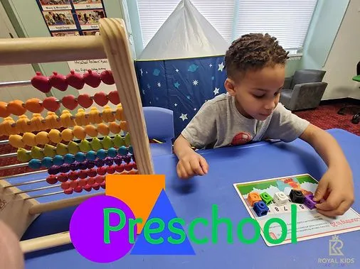 Preschool child exploring a tabletop learning activity with colorful manipulatives